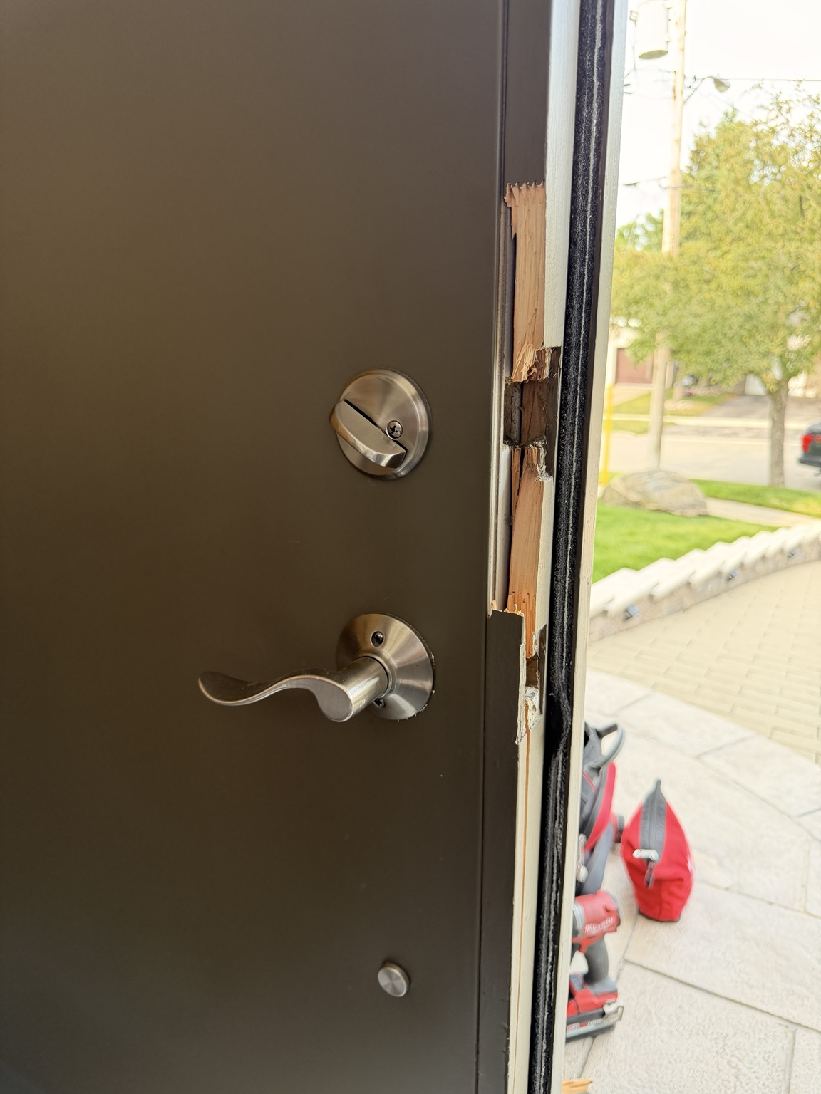 Before: Second view of break-in damage on Etobicoke entry door