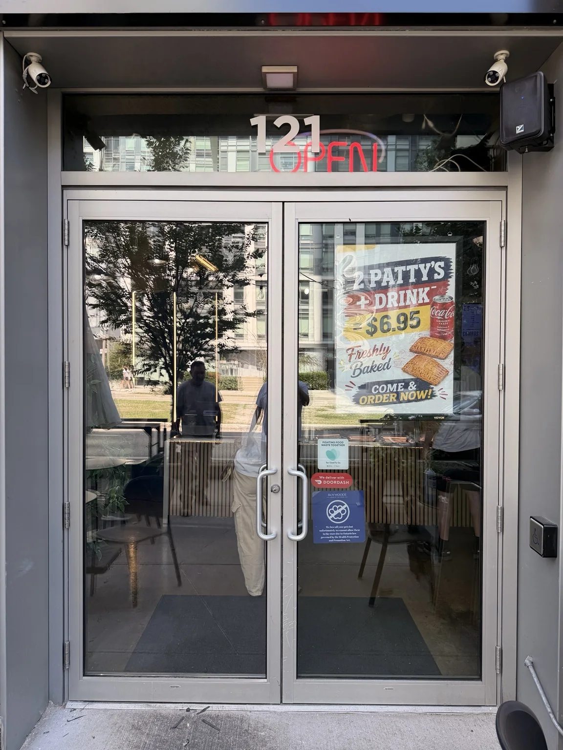 Commercial entry door after replacement glass installation in CityPlace, Toronto